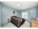 A calming bedroom with blue walls, a comfortable bed, and a bright window at 9660 Old Haggard Rd, Morgantown, IN 46160