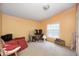 Bedroom with a single window, desk, and neutral carpet at 9660 Old Haggard Rd, Morgantown, IN 46160