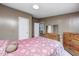 Bedroom with light walls, wooden bed frame, and a dresser at 9660 Old Haggard Rd, Morgantown, IN 46160