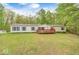 Well-maintained home with a spacious front lawn and inviting front deck at 9660 Old Haggard Rd, Morgantown, IN 46160