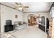 Inviting living room featuring neutral walls, carpeted floors, comfortable seating, and a ceiling fan at 9660 Old Haggard Rd, Morgantown, IN 46160