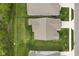 An aerial view showcases the home's roof, driveway, and well-maintained lawn at 9696 Parkhurst Xing, McCordsville, IN 46055