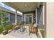 Comfortable back patio with outdoor seating, string lights, and an outdoor rug for a relaxing space at 9696 Parkhurst Xing, McCordsville, IN 46055
