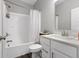 Well-lit bathroom with a shower-tub combo, vanity with white cabinets and a modern faucet at 9696 Parkhurst Xing, McCordsville, IN 46055