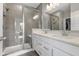 Luxurious bathroom features a glass-enclosed shower, dual sinks, and modern fixtures at 9696 Parkhurst Xing, McCordsville, IN 46055
