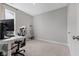 Neutral bedroom featuring carpeted floors, a computer desk and chair, and plenty of natural light at 9696 Parkhurst Xing, McCordsville, IN 46055
