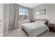 Cozy bedroom featuring a queen bed, neutral decor, and a large window for ample natural light at 9696 Parkhurst Xing, McCordsville, IN 46055