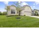 Beautiful single-story home with a well-manicured lawn, neutral brick, and an attached two-car garage at 9696 Parkhurst Xing, McCordsville, IN 46055