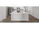 Modern kitchen island features a white countertop and stainless steel sink, creating a stylish focal point at 9696 Parkhurst Xing, McCordsville, IN 46055