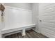 Organized mudroom includes a built-in bench and hooks, providing a convenient space for storage and organization at 9696 Parkhurst Xing, McCordsville, IN 46055