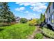 Beautiful backyard with a green lawn, mature trees, and thoughtful landscaping; ideal for relaxation at 10746 Gateway Dr, Fishers, IN 46037