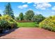 Large backyard features a well-manicured lawn and mature landscaping, as seen from the wooden deck at 10746 Gateway Dr, Fishers, IN 46037