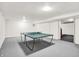 Finished basement with ping pong table, perfect for recreation and entertaining guests at 10746 Gateway Dr, Fishers, IN 46037