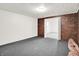 Spacious basement room with brick accent wall and neutral carpet offers plenty of potential at 10746 Gateway Dr, Fishers, IN 46037