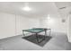 Finished basement featuring a ping pong table, offering a fun recreational space at 10746 Gateway Dr, Fishers, IN 46037