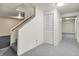 Finished basement area with stairs, closet, and neutral carpet, perfect for additional living space at 10746 Gateway Dr, Fishers, IN 46037
