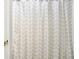 Close-up of shower curtain with zig-zag pattern and a peek into an open door at 10746 Gateway Dr, Fishers, IN 46037