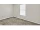 Bedroom features a neutral color palette, carpet floor and a bright window at 10746 Gateway Dr, Fishers, IN 46037
