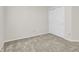 Bright bedroom features neutral walls, plush carpeting, and closet with sliding doors at 10746 Gateway Dr, Fishers, IN 46037