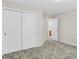 Bedroom features a carpet floor, access to ensuite bath, and double closets for ample storage at 10746 Gateway Dr, Fishers, IN 46037