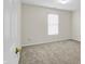 Bedroom features a neutral color palette, carpet floor and a bright window at 10746 Gateway Dr, Fishers, IN 46037