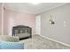 Bedroom features gray and pink accent walls, a crib, and a polka dot armchair at 10746 Gateway Dr, Fishers, IN 46037