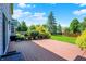 Wooden deck overlooks a well-maintained lawn, framed by mature trees and landscaping, perfect for outdoor enjoyment at 10746 Gateway Dr, Fishers, IN 46037