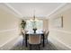 Bright dining room featuring a chandelier, large table, and a large window providing abundant natural light at 10746 Gateway Dr, Fishers, IN 46037
