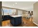Modern kitchen featuring an island, stainless steel appliances, and an open layout connecting to the dining area at 10746 Gateway Dr, Fishers, IN 46037