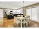 View of the kitchen from the dining area. The kitchen features stainless steel appliances and a center island at 10746 Gateway Dr, Fishers, IN 46037