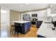 Contemporary kitchen with white countertops, modern appliances, and a center island with additional seating at 10746 Gateway Dr, Fishers, IN 46037