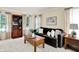 Cozy living room featuring a plush sofa, wooden bookshelf, and natural lighting at 10746 Gateway Dr, Fishers, IN 46037