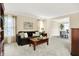 Comfortable living room with neutral carpet, a brown couch, and nice windows at 10746 Gateway Dr, Fishers, IN 46037