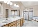 Main bathroom features a large double sink vanity, glass enclosed shower and soaking tub at 10746 Gateway Dr, Fishers, IN 46037