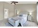 Bright main bedroom with ensuite access features vaulted ceilings, carpeted floor, and neutral colors at 10746 Gateway Dr, Fishers, IN 46037