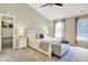 Bright main bedroom features a vaulted ceiling, ceiling fan, neutral colors and a carpeted floor at 10746 Gateway Dr, Fishers, IN 46037