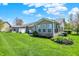 A spacious backyard provides ample space for outdoor activities and features a patio, landscaping, and privacy fence at 10992 Chapel Woods S Blvd, Noblesville, IN 46060