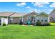 A well-kept lawn and patio furniture make for an inviting outdoor space, perfect for relaxation and entertaining at 10992 Chapel Woods S Blvd, Noblesville, IN 46060