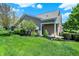 Beautiful backyard with well-maintained lawn, manicured landscaping, and a serene outdoor setting at 10992 Chapel Woods S Blvd, Noblesville, IN 46060