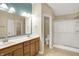 Spacious bathroom with double vanity, tiled floors, a walk in shower, and neutral color palette at 10992 Chapel Woods S Blvd, Noblesville, IN 46060