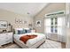 Bright bedroom features vaulted ceilings, stylish decor, large windows and comfortable furniture at 10992 Chapel Woods S Blvd, Noblesville, IN 46060