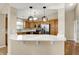 Kitchen with stainless steel appliances, white countertops, and light wood cabinets at 10992 Chapel Woods S Blvd, Noblesville, IN 46060