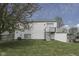 A large grassy backyard with a white house in the background and a wooden fence at 110 Meadow Creek Blvd, Whiteland, IN 46184