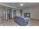 Basement area features a sofa and leads to a staircase, storage and utility space at 110 Meadow Creek Blvd, Whiteland, IN 46184