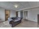 Basement features a sofa with access to bathroom, laundry, and storage spaces at 110 Meadow Creek Blvd, Whiteland, IN 46184