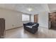 Finished basement space with comfortable gray sofa and access to additional rooms at 110 Meadow Creek Blvd, Whiteland, IN 46184