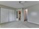 A bedroom showcasing a closet with mirrored doors, carpet and two doorways at 110 Meadow Creek Blvd, Whiteland, IN 46184