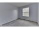 Carpeted bedroom with natural light from the window, offering a simple and peaceful space at 110 Meadow Creek Blvd, Whiteland, IN 46184