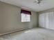 This bedroom has a large window, closet, and neutral carpet at 110 Meadow Creek Blvd, Whiteland, IN 46184