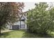 View of a home's exterior with a well-kept lawn and a variety of trees at 110 Meadow Creek Blvd, Whiteland, IN 46184